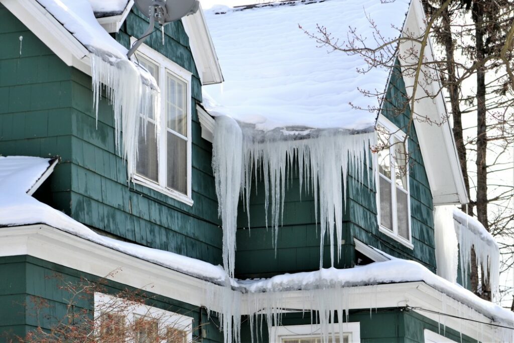 Ice dams on a roof can damage your roof which will need to be replaced