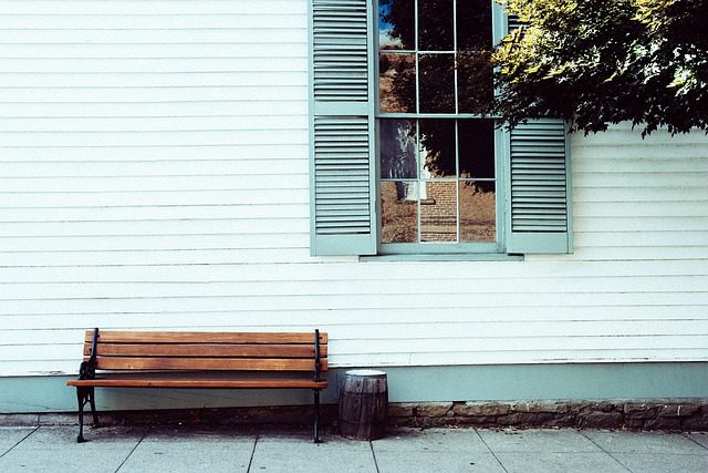 a bench sits in front of a building