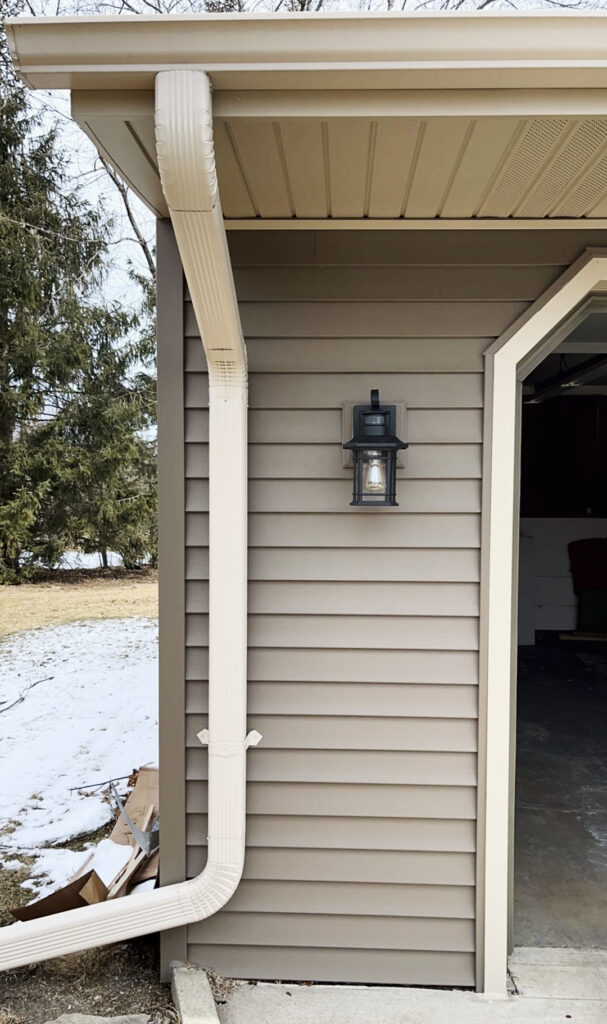 photo of downspout attached to the home