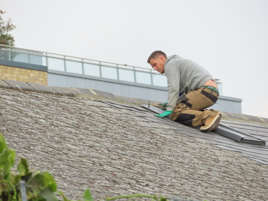 Man installs a roof