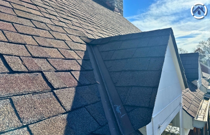 Asphalt shingles curling due to weather exposure, age, or other factors