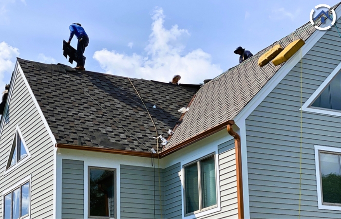 Roofing technicians installing a new roof