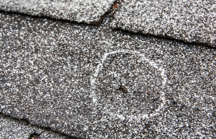 an example of a hail damage — a bruised shingle