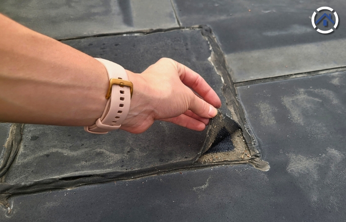 Why Flat Roofs Fail: A separation of the seam of an EPDM roof where water may penetrate
