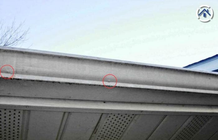 Dents on gutters are visible signs of hail damage