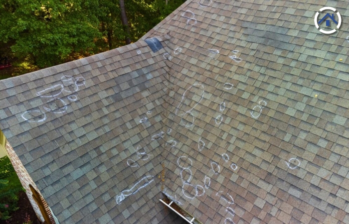 Roofing and home insurance — Hail damage marks on roof