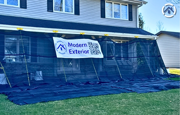 protect your home's exterior during roof replacement by placing net covers or tarps